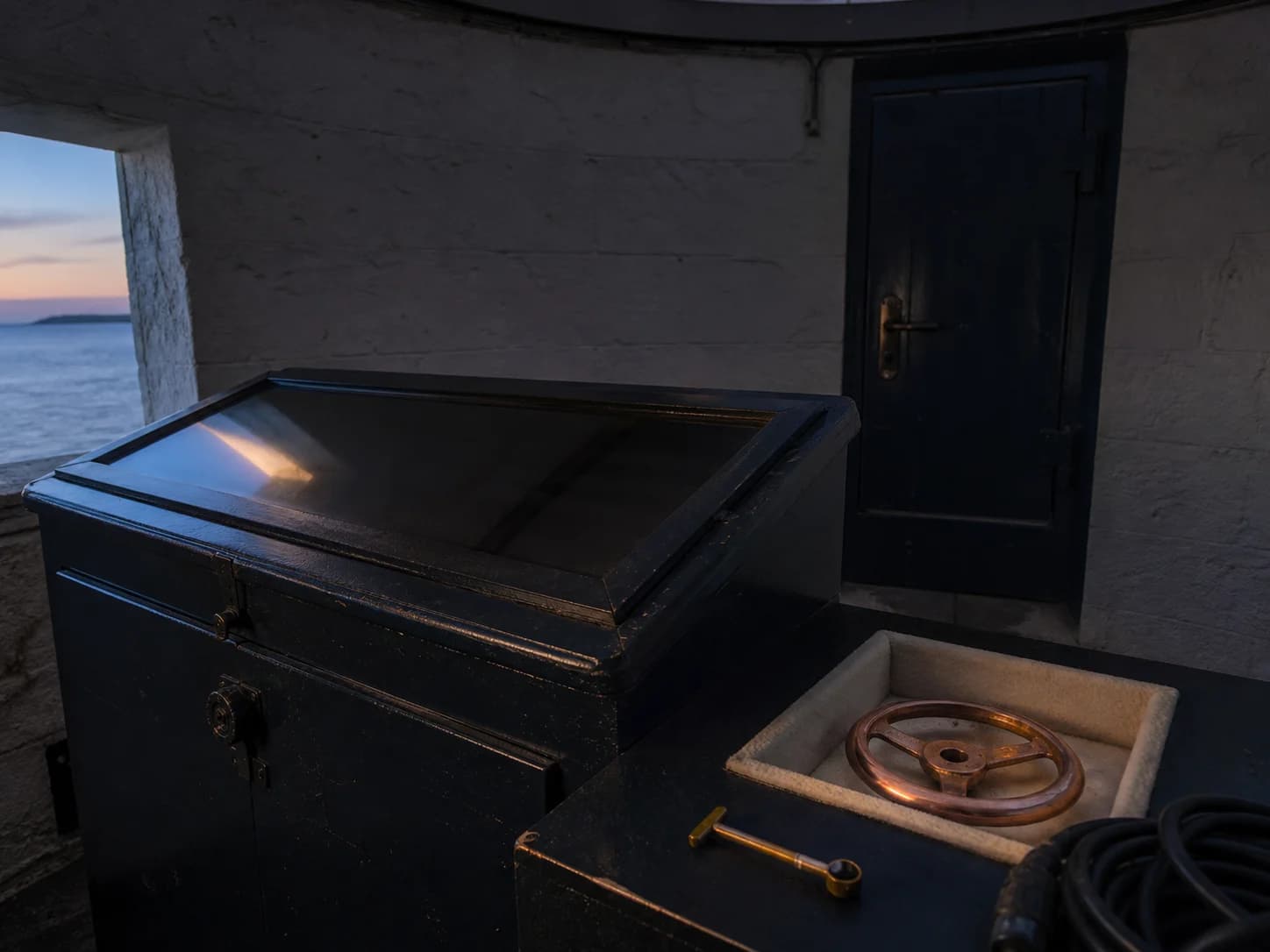 Astronomy console beside a closed field notebook
